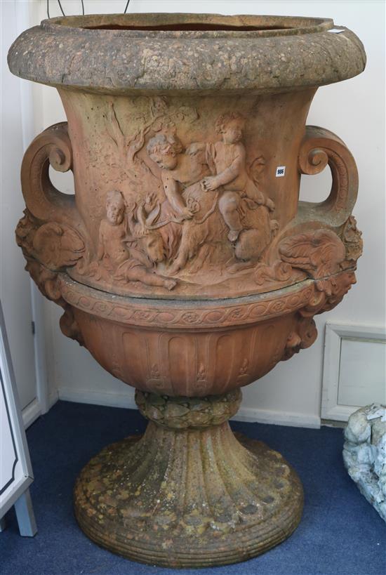 A large Neo Classical style terracotta urn W.90cm. approx.